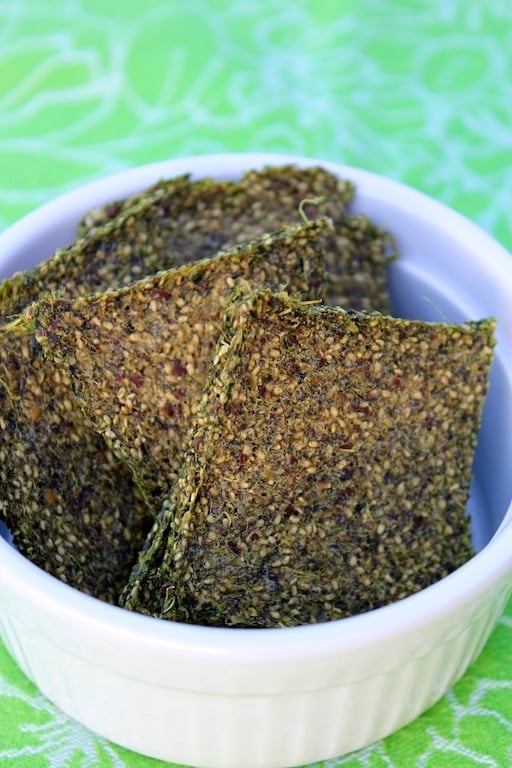 green juice pulp crackers in a white bowl.