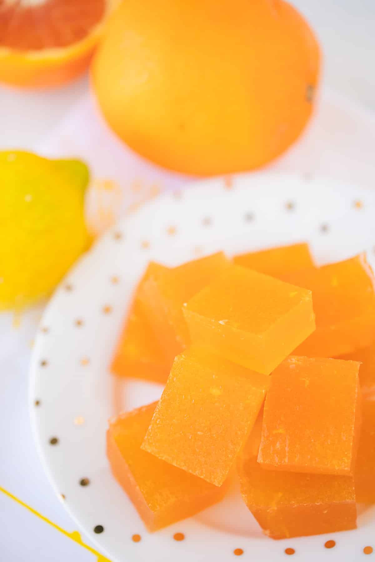 homemade orange jello on a table.