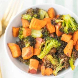 bowl of roasted vegetables with a gold fork