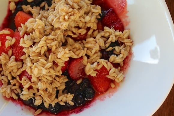 Bowl of sprouted oat groat cereal with berries