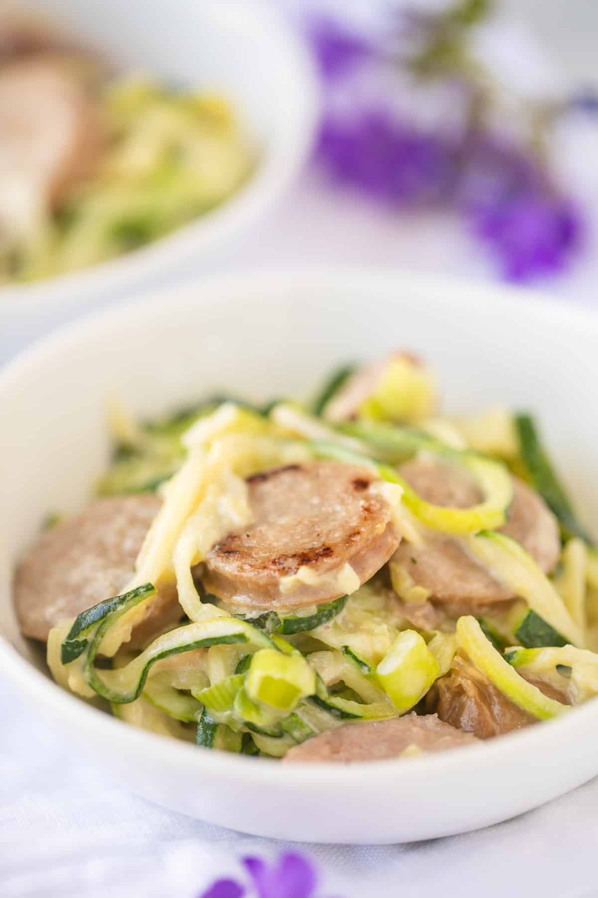 bowl of zoodles and sausage ready to eat