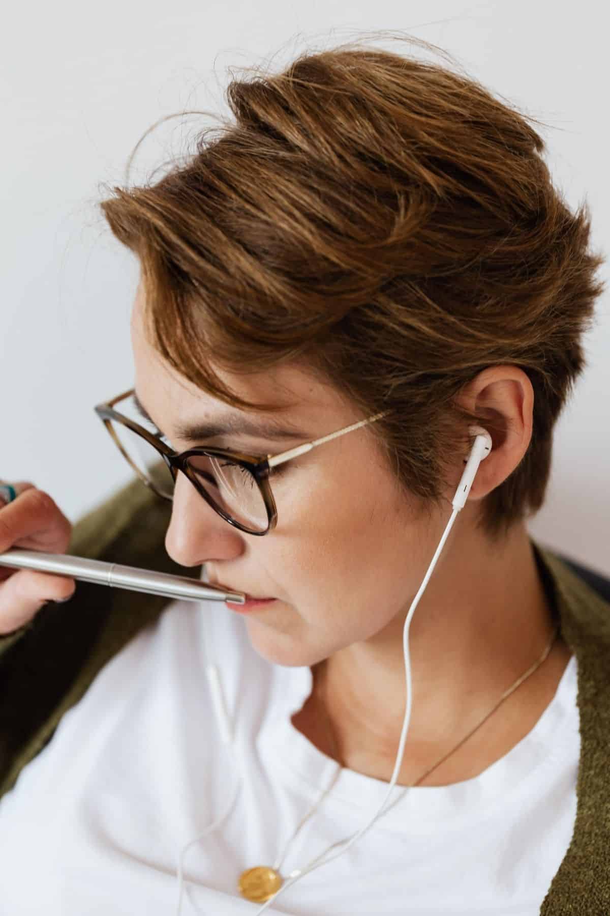 woman listening to a podcast on headphones