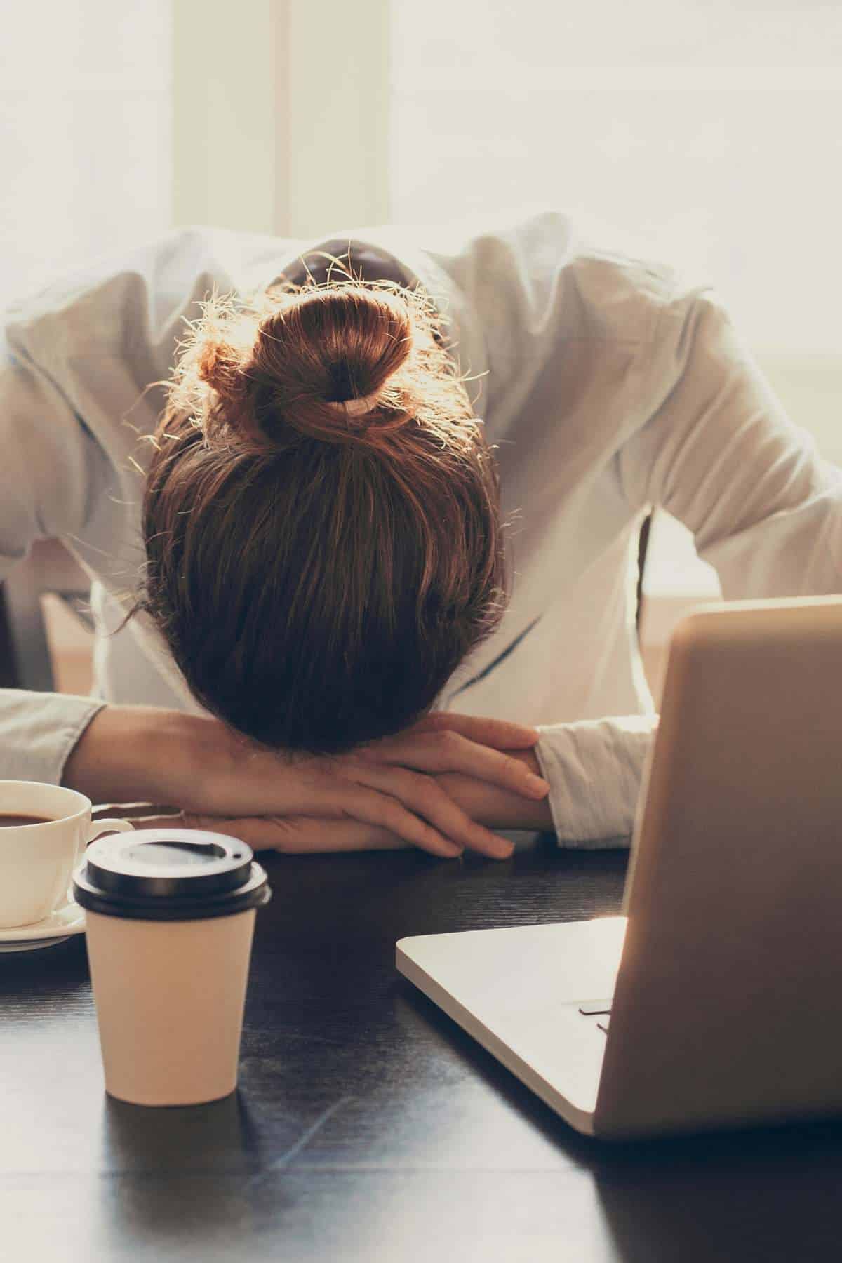 tired woman at computer