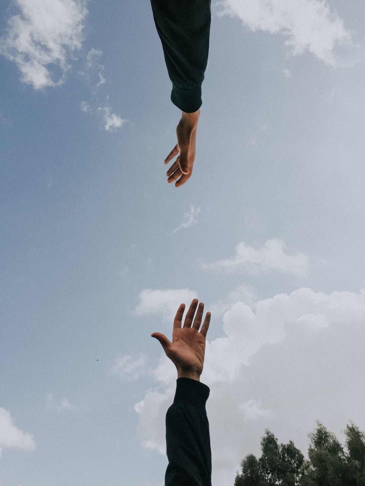 two hands reaching out to meet each other