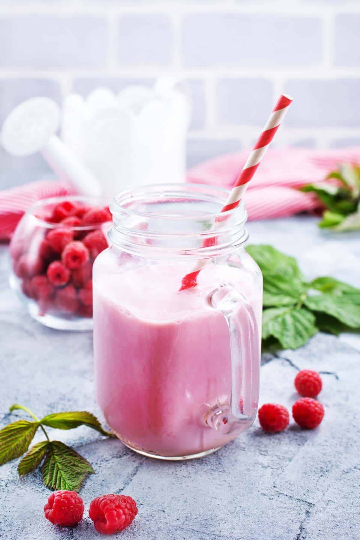 raspberry smoothie with a striped straw