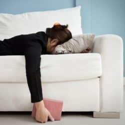 woman laying on a couch facedown