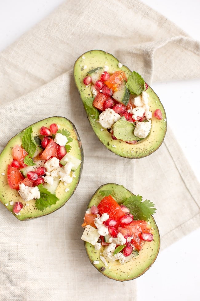 stuffed avocados with tomato and cheese.