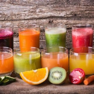 fresh juices lined up on a countertop