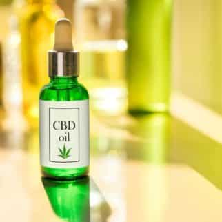 photo with a bottle of cbd oil