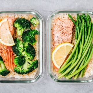 two meal prep bowls with salmon and veggies