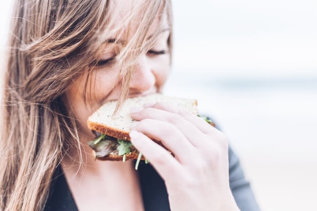 Girl eating sandwich