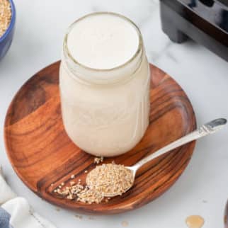 jar of oat milk on a table