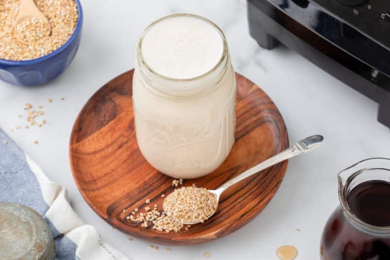jar of oat milk on a table