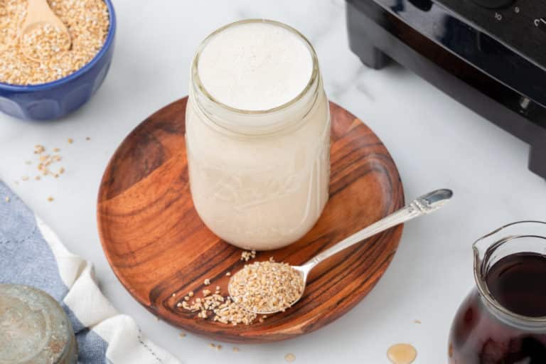 jar of oat milk on a table