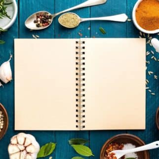 blank journal with spices around it