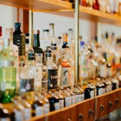 Alcohol bottles on a bar shelf
