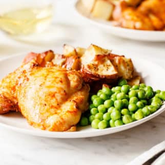dinner plate with chicken, peas and potatoes