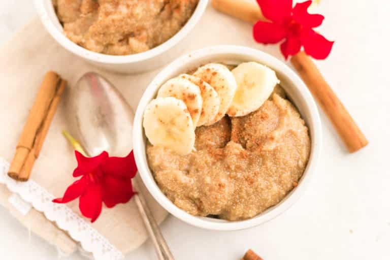 amaranth porridge in a bowl with sliced bananas.