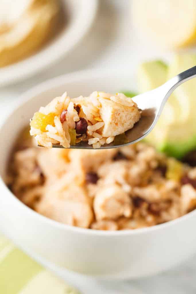 Mexican chicken and rice casserole on a fork.