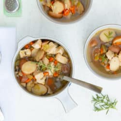 two bowls of instant pot chicken stew with spoons.