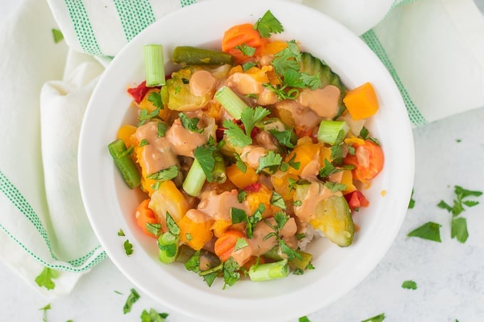 frozen vegetables peanut butter sauce in a white bowl