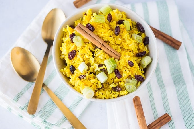 coconut rice in a bowl with two spoons