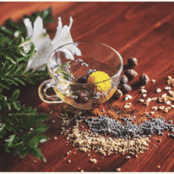 Herbal tea ingredients in a clear serving mug