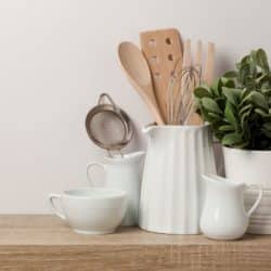 utensils in white pottery on a countertop