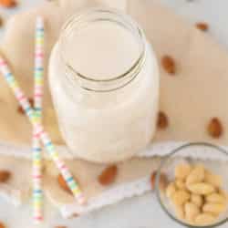 jar of homemade almond milk on table