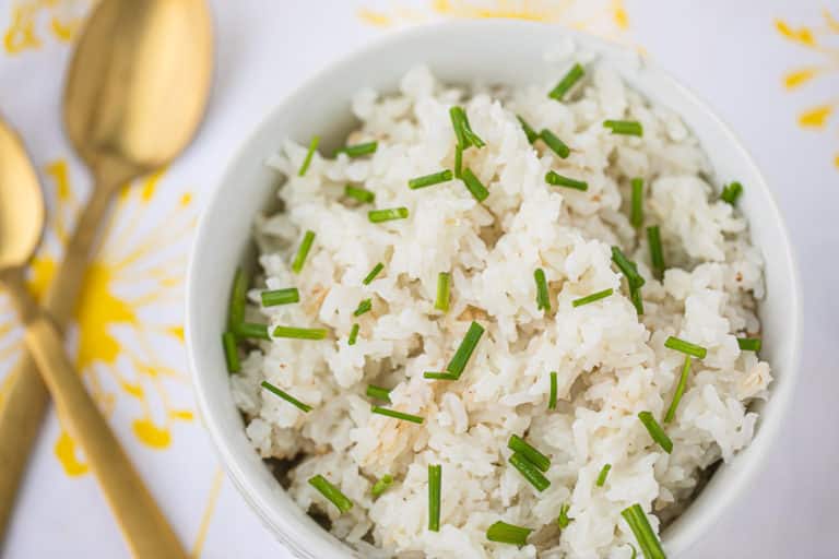 bowl of cooked white rice with chives on top