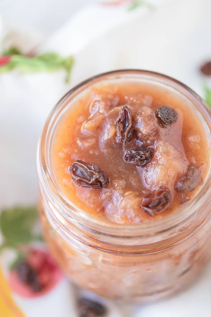 instant pot cinnamon raisin applesauce in a jar with raisins