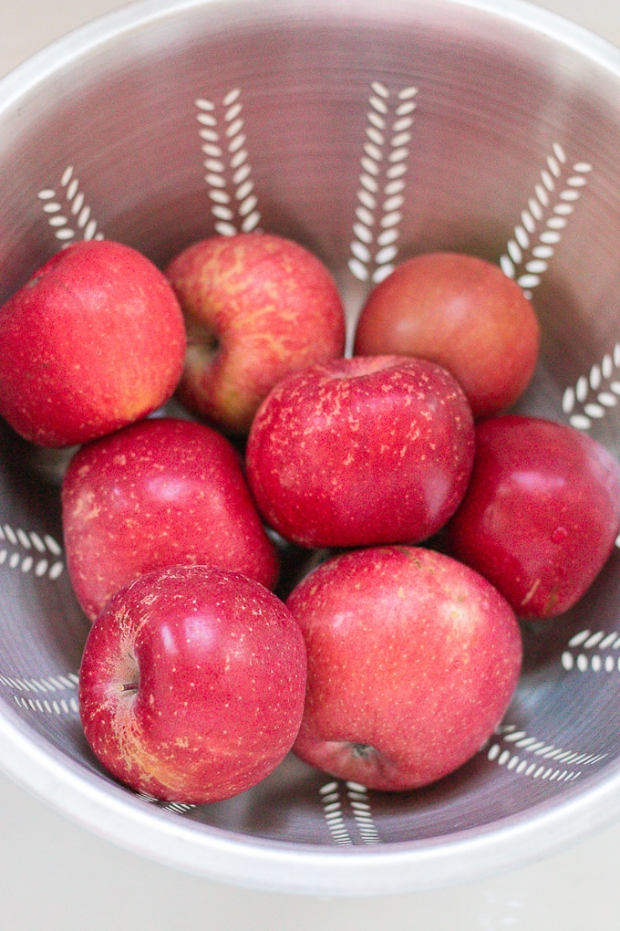 fuji apples in a colander to be washed
