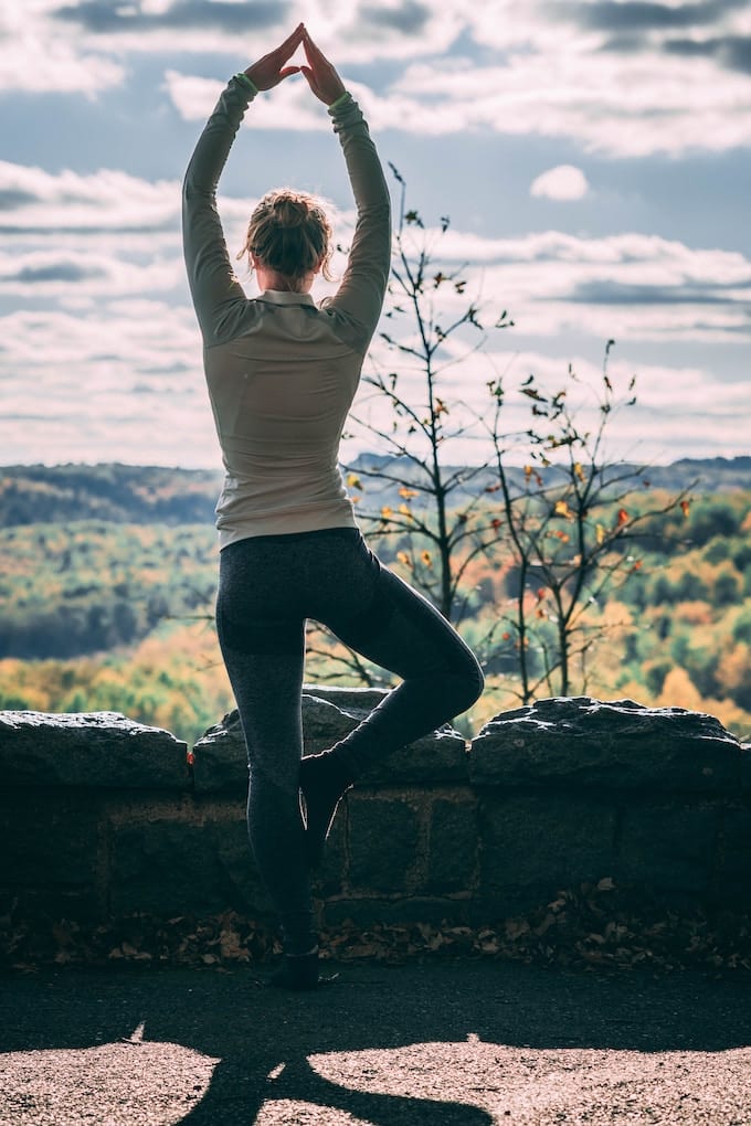 woman doing yoga outside.