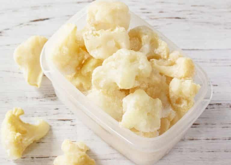 frozen cauliflower florets in a container.