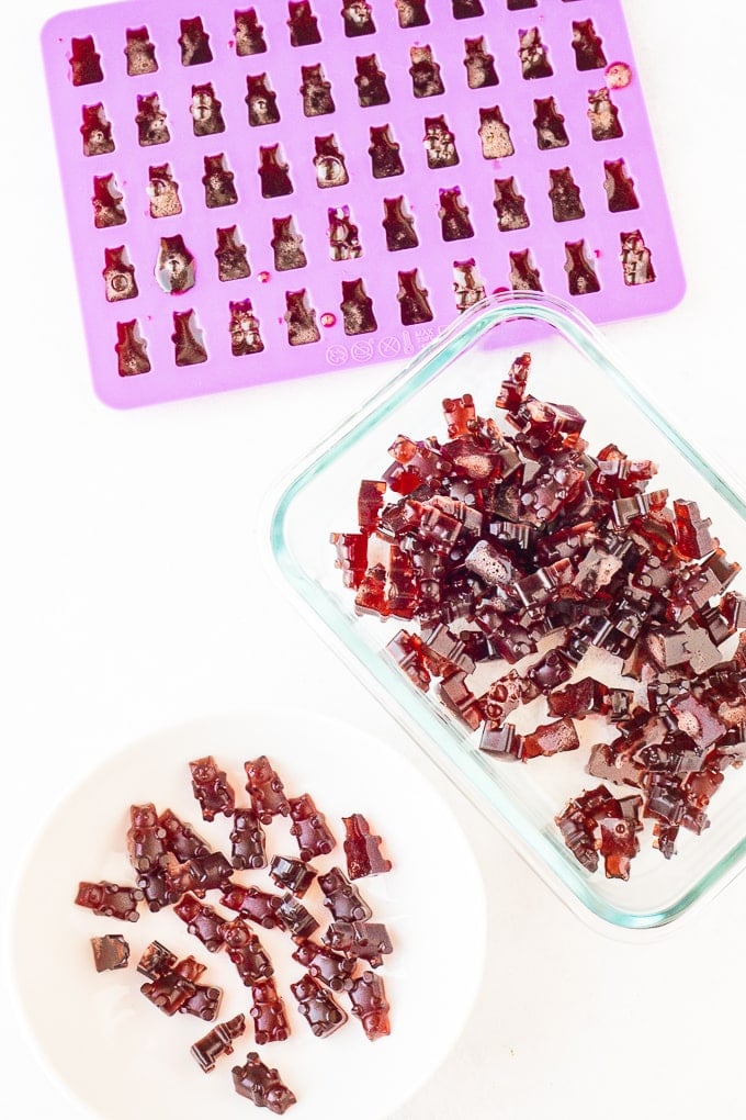 gummy bears in a mold and a glass container