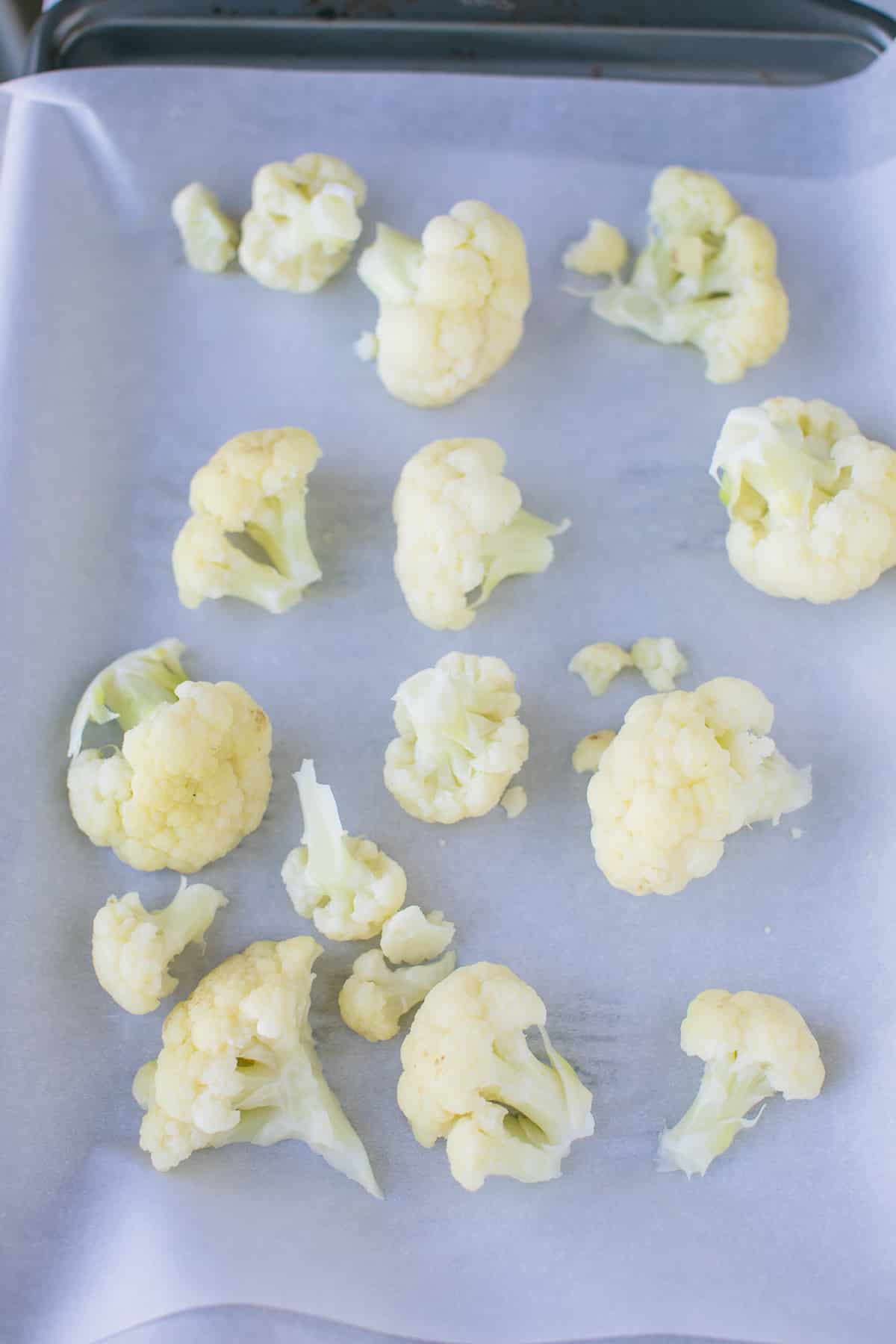 cauliflower florets on a baking sheet