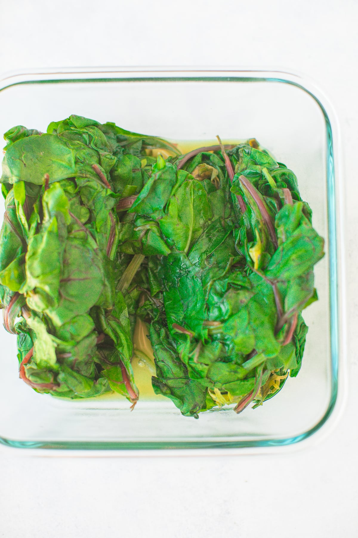 steamed greens in a glass container