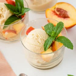 two bowls of dairy free peach ice cream