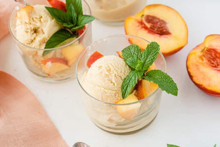 two bowls of dairy free peach ice cream