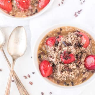 bowl of cauliflower oatmeal with strawberries.
