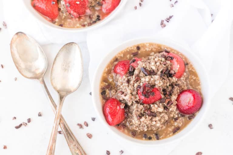 bowl of cauliflower oatmeal with strawberries.