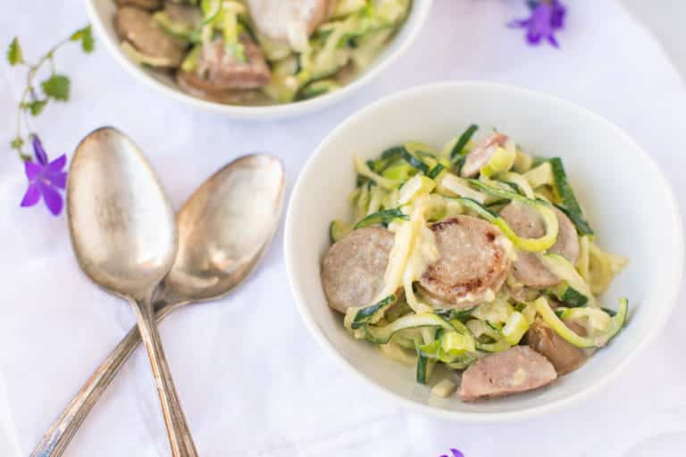 two bowls with zucchini noodles with sausage