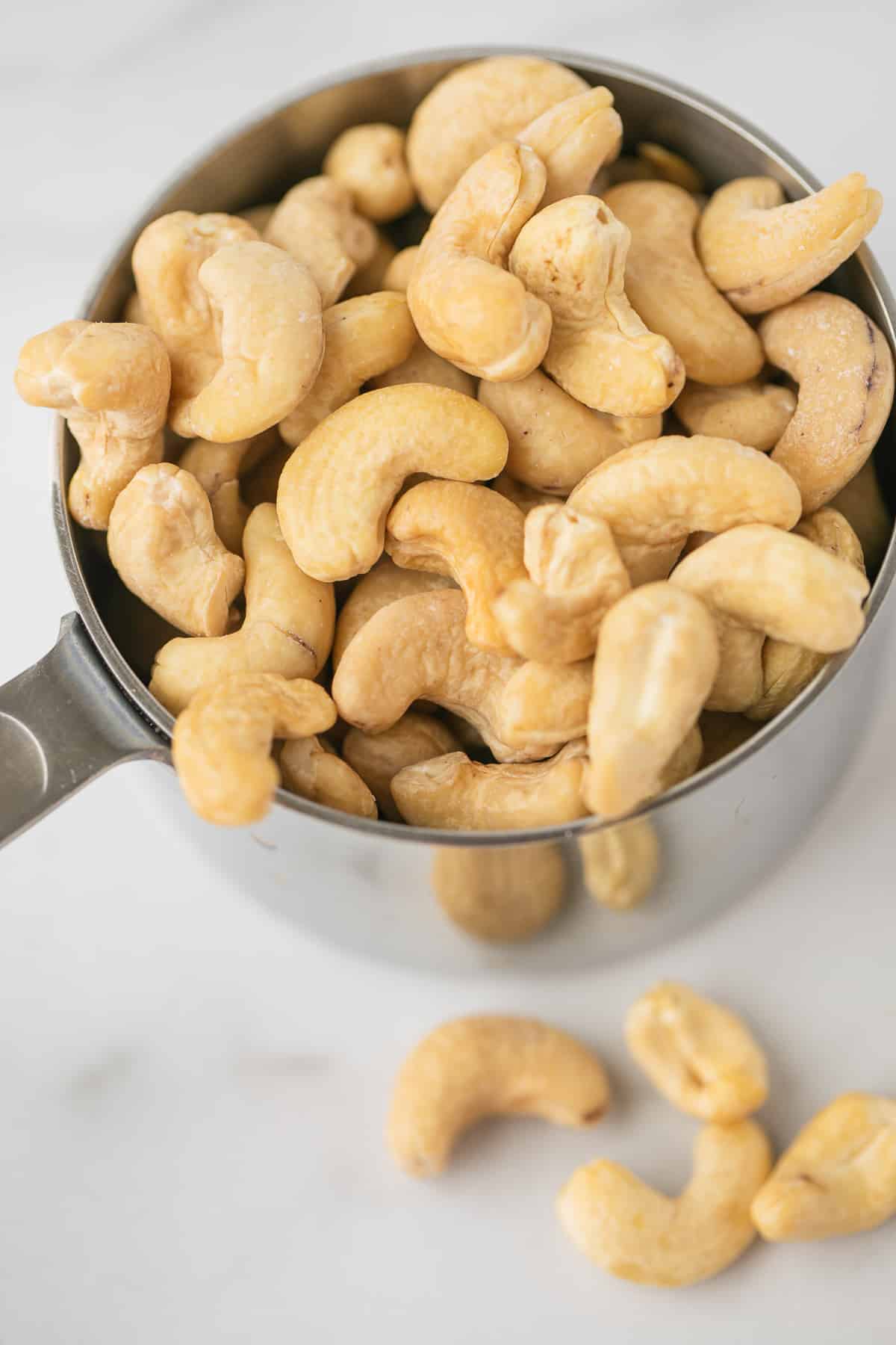 cashews in a measuring cup