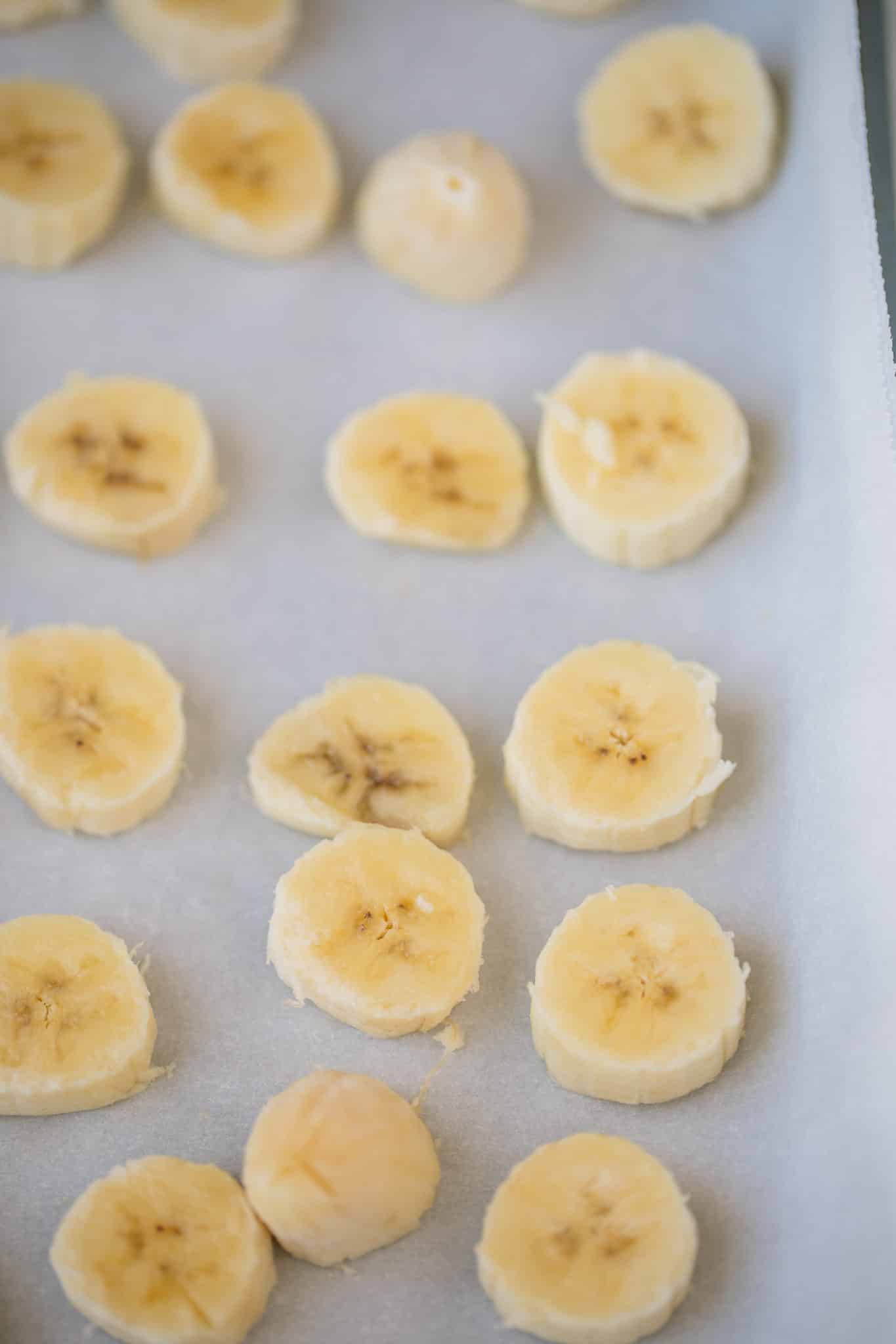sliced bananas on a baking sheet