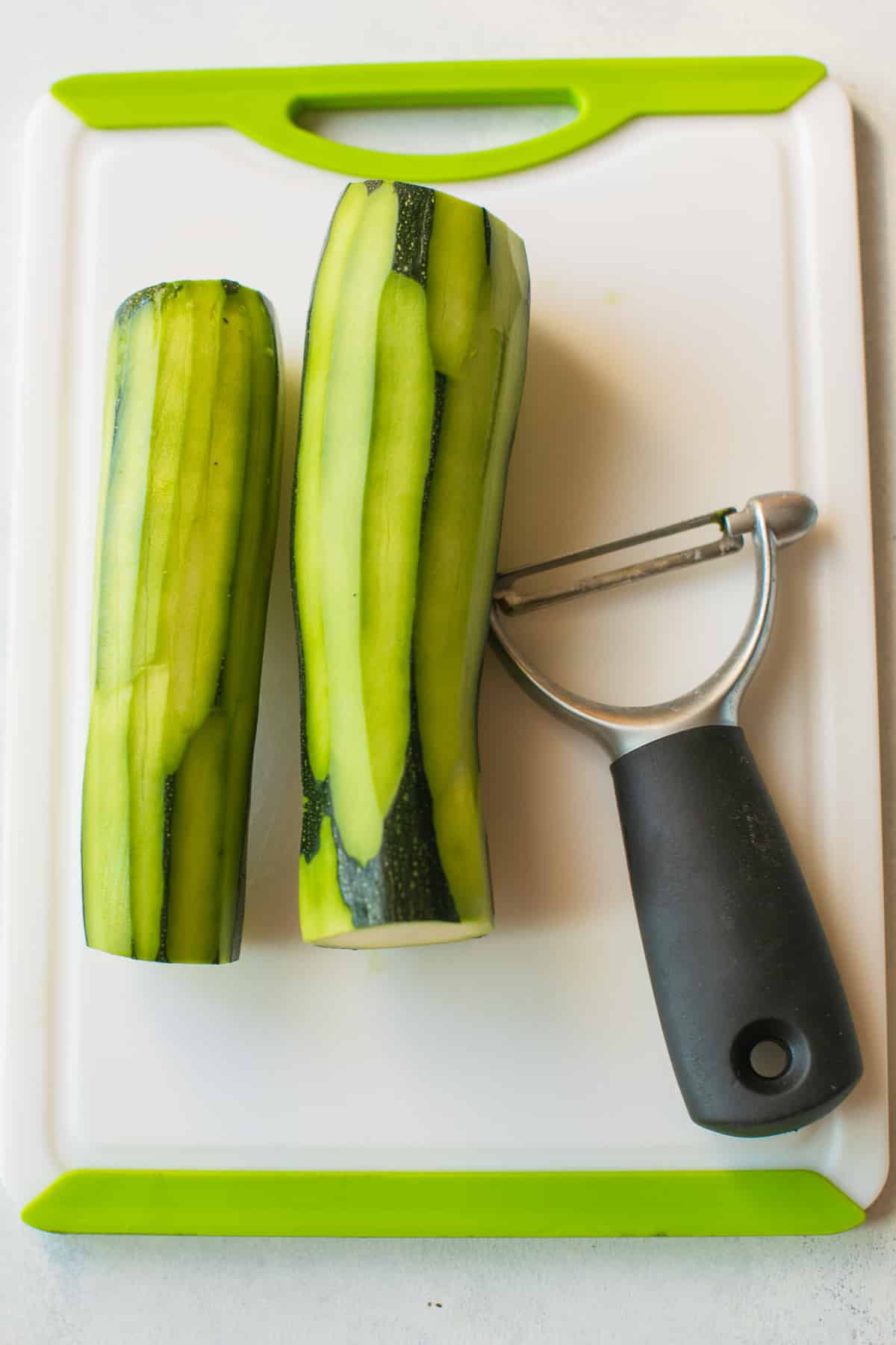 peeled zucchini on a cutting board