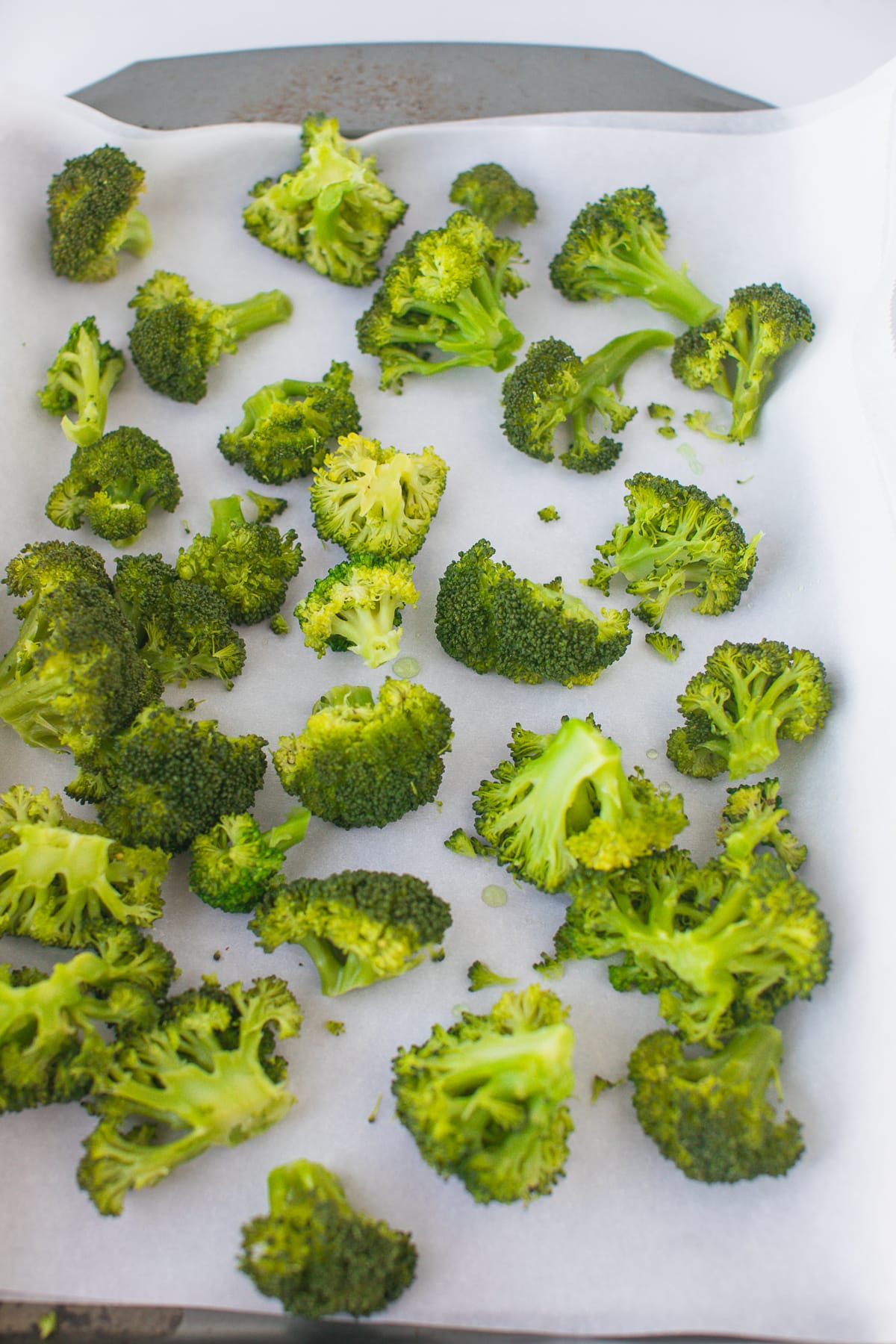 blanched broccoli on baking sheet