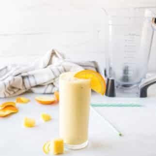 pineapple orange smoothie in glass.