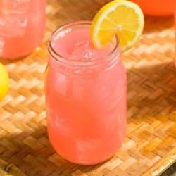 pink kombucha lemonade on tabletop.