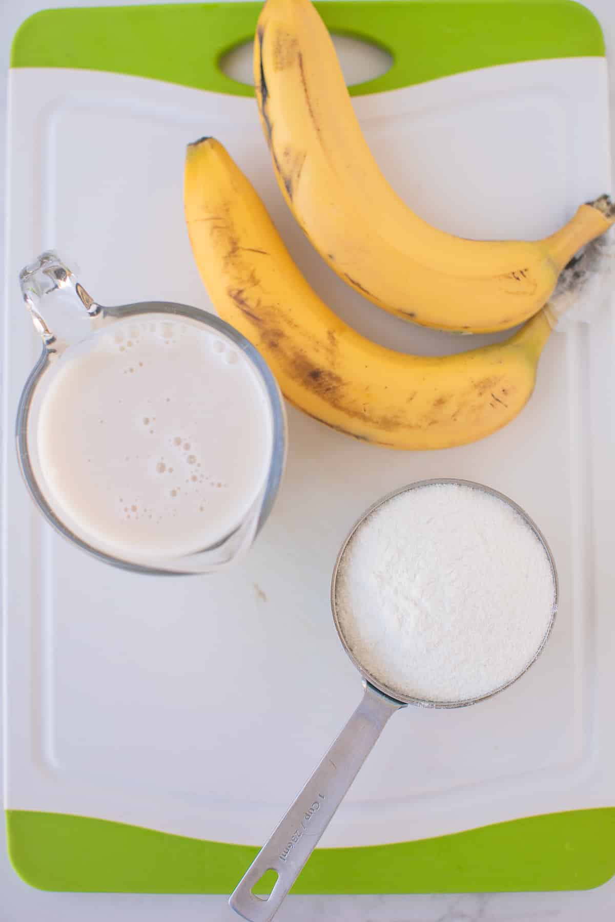 Two ripe bananas, almond milk, and rice flour to make pancakes
