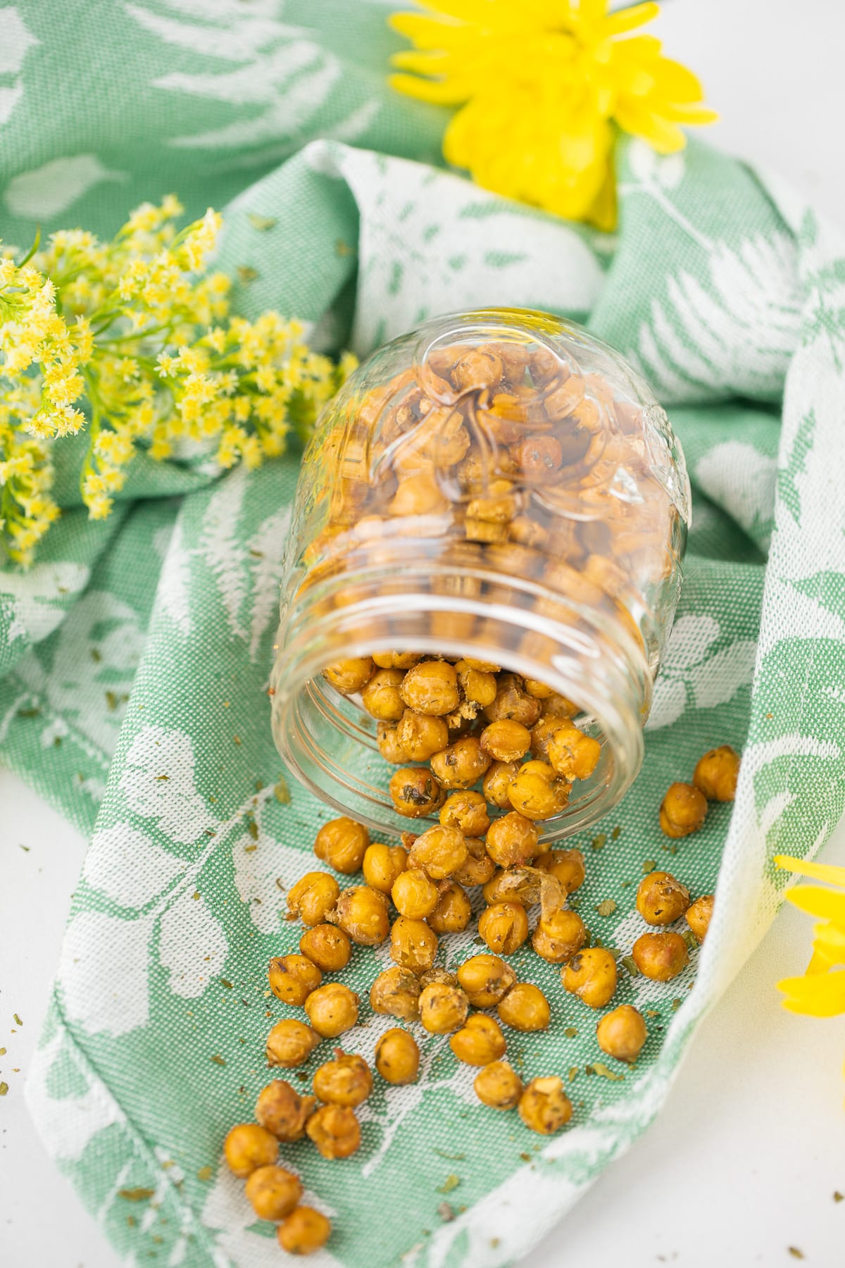 clear glass jar filled with crispy ranch roasted chickpeas.
